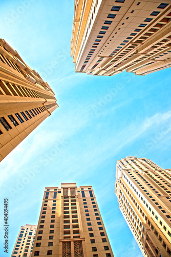 Obraz na płótnie Abstract architectural image with skyscrapers on sky background. w salonie