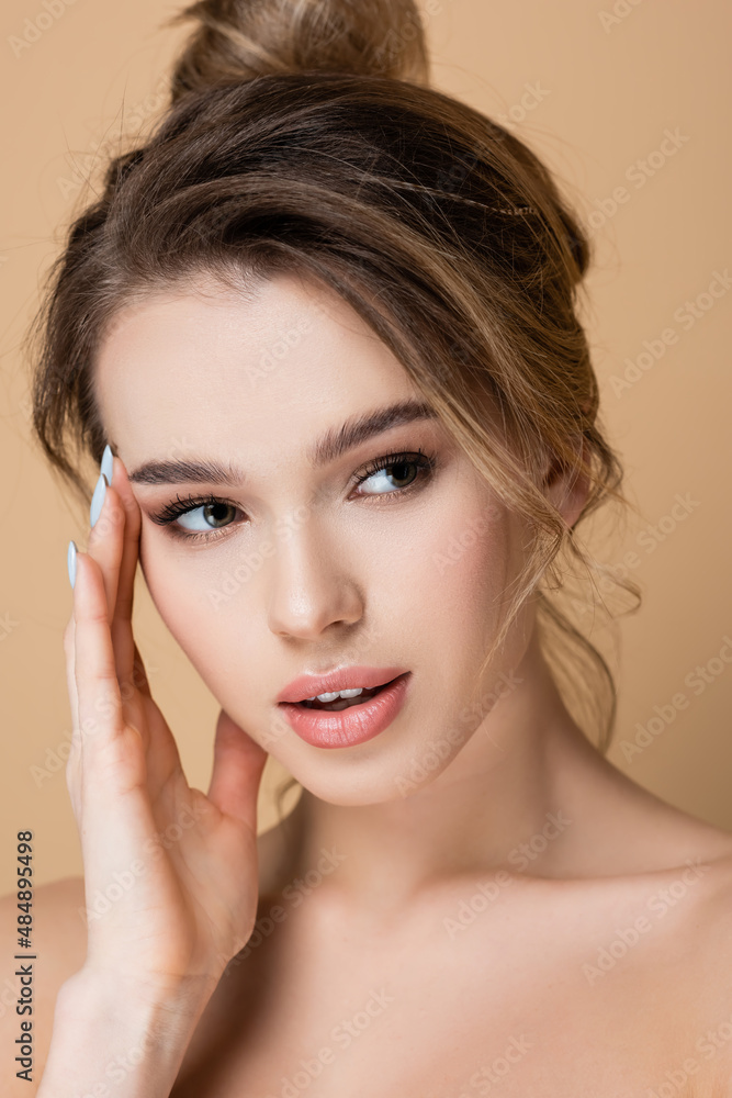 close up view of pretty woman with perfect skin and natural makeup isolated on beige. close up view of pretty woman with perfect skin and natural makeup isolated on beige.