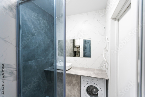 Modern bathroom with grey tiles  seamless  luxurious interior background.