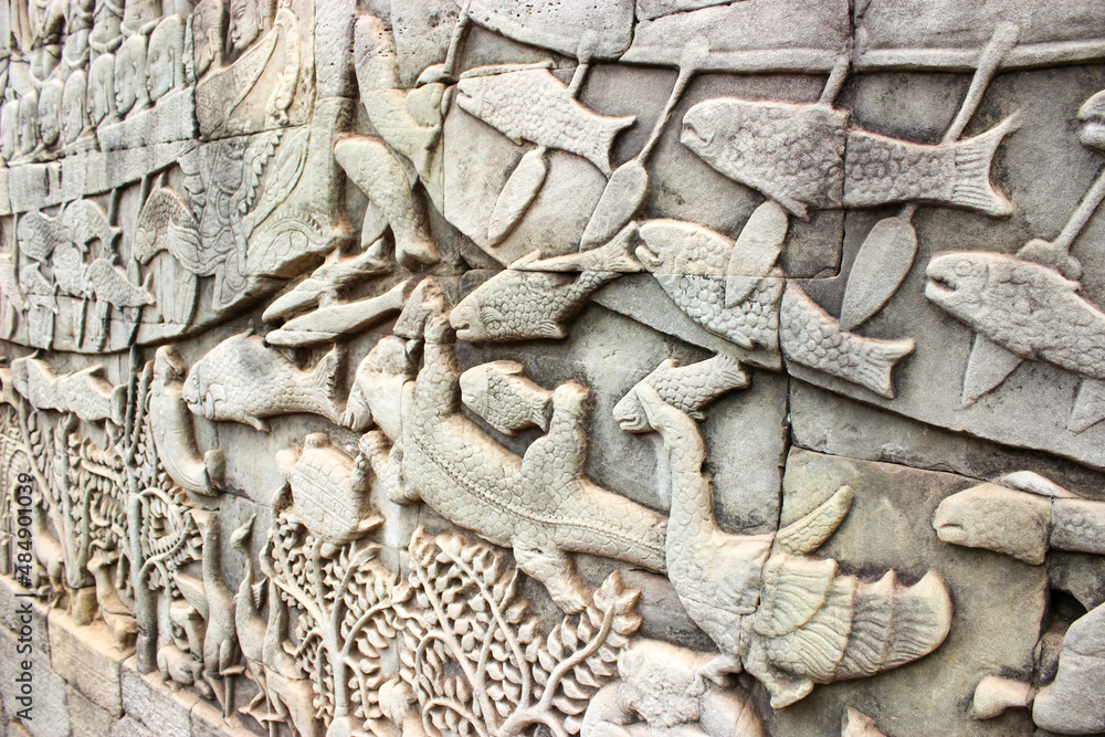 Mythological storytelling carved into the walls of Angkor Wat