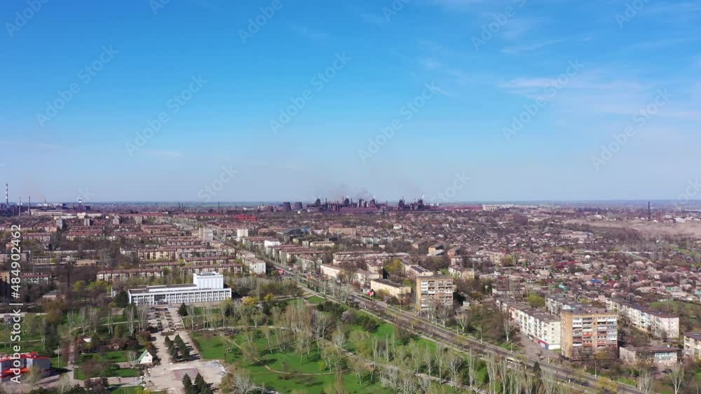 Metallurgical plant in the city center. Aerial view.Harmful production and air pollution. Metallurgical plant in the city center. Aerial view.Harmful production and air pollution.