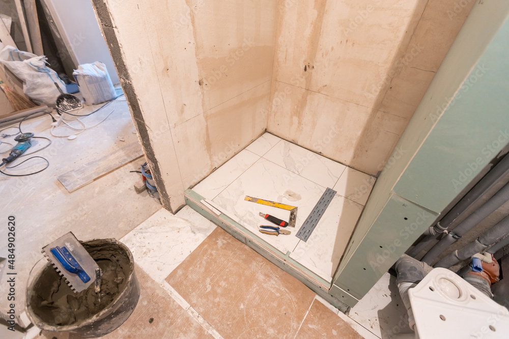 bathroom renovation and tiling. Laying floor ceramic tile bathroom renovation and tiling. Laying floor ceramic tile