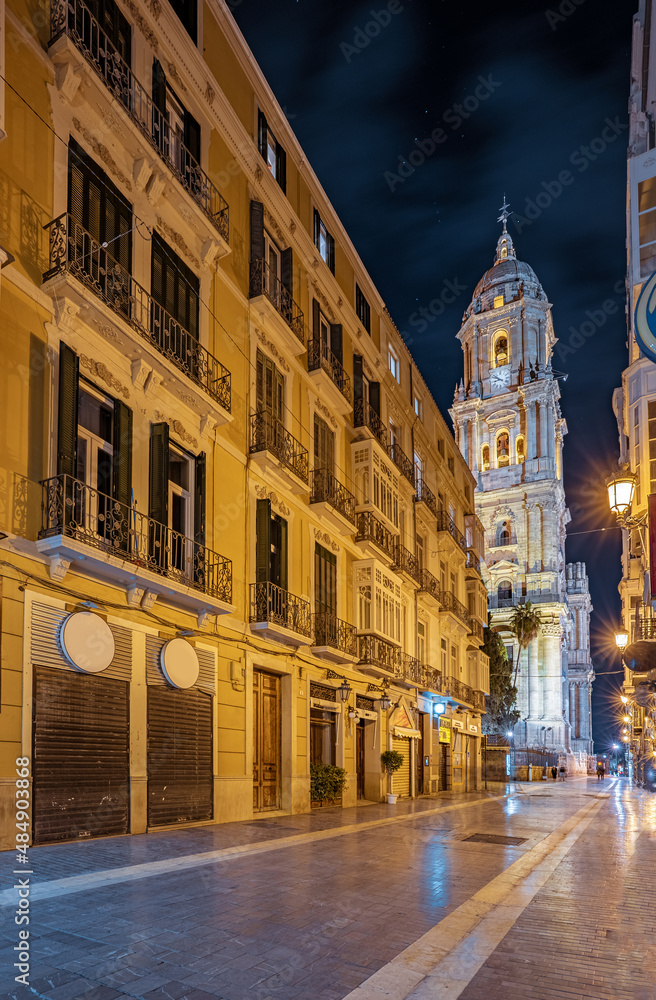 Night view streets and the cathedral in Malaga, Spain. Beautiful cityscape of the sightseeing spots of the city