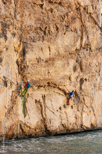 Climbing in Raco del Corv cove /  Luces Nocturnas route 6b photo