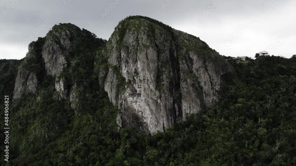 Cerro Las Tetas Puerto Rico Mountains drone push out shot with jungle.
Cerro Las Tetas Puerto Rico Mountains drone push out shot with jungle.