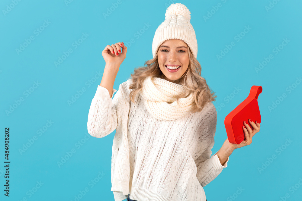 stylish young woman holding wireless speaker stylish young woman holding wireless speaker