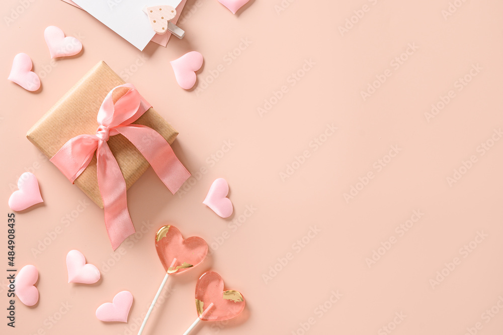 Valentine's day greeting card with gift, love letter,two sweets lollipops and pink hearts on pink background. View from above. Space for text. Flat lay. Valentine's day greeting card with gift, love letter,two sweets lollipops and pink hearts on pink background. View from above. Space for text. Flat lay.