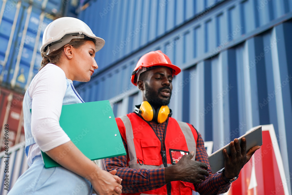 Foreman checking and control loading containers box in import-export area from Cargo freight ship. Foreman checking and control loading containers box in import-export area from Cargo freight ship.