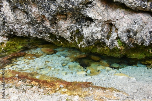 Water at the spring of Nadiza in Tamar valley, Slovenia photo