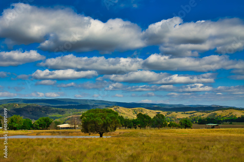 Rolling hills with meadows, trees, a dam and forest in Central Victoria, Australia, between Heathcote and Castlemain 