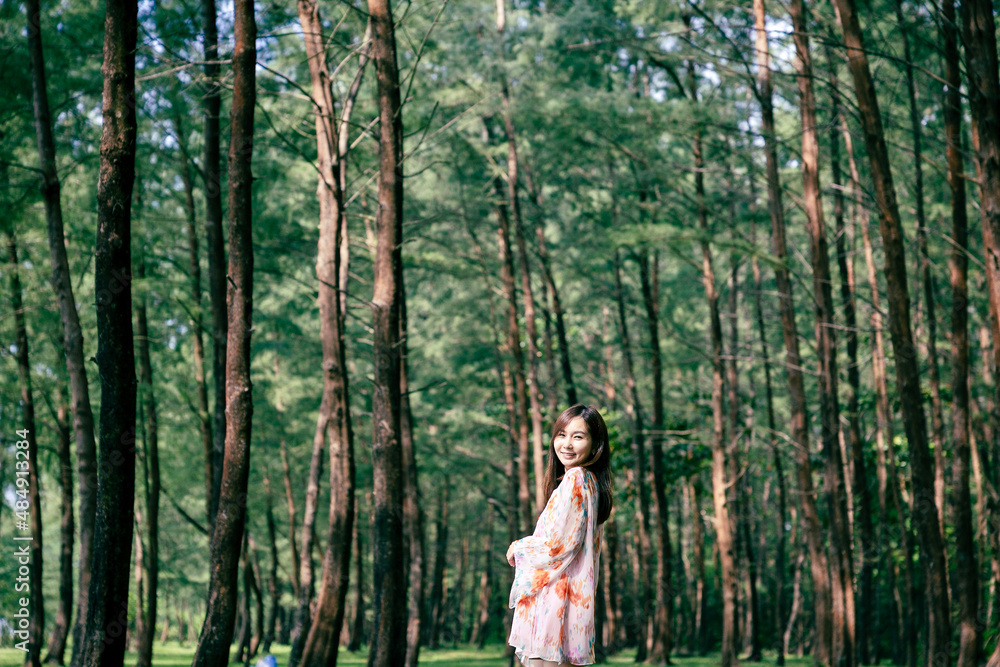Asian girl walking in Pine forest in Laem Son national park, Ranong, Thailand Asian girl walking in Pine forest in Laem Son national park, Ranong, Thailand