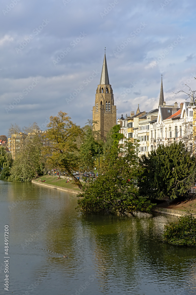 Church of the holy cross, reflecting in the water of Ixelles lakes Church of the holy cross, reflecting in the water of Ixelles lakes