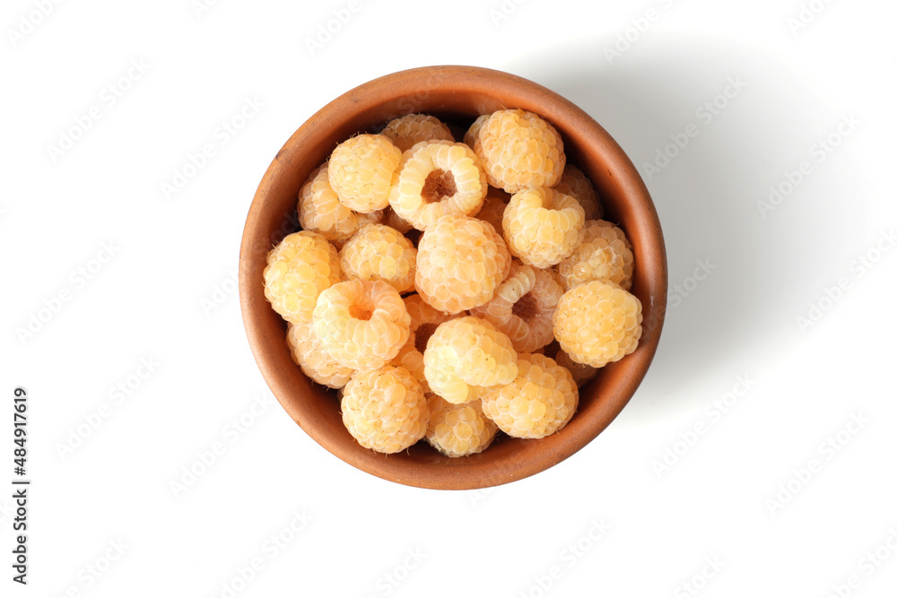 composition of ripe raspberries in a bowl on a textured background composition of ripe raspberries in a bowl on a textured background
