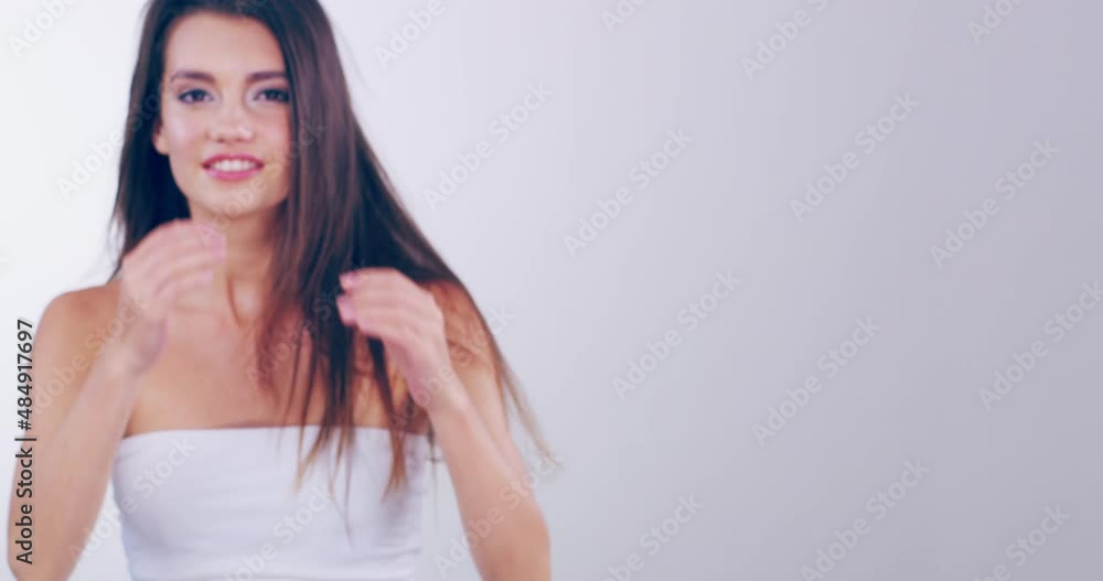 Let your gorgeous hair loose and enjoy it. 4k video footage of a beautiful young woman playing with her hair in the studio. Let your gorgeous hair loose and enjoy it. 4k video footage of a beautiful young woman playing with her hair in the studio.