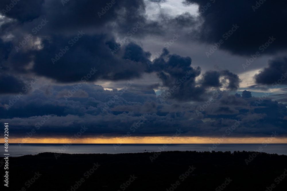 Cloudy sky over serene sea in evening Cloudy sky over serene sea in evening
