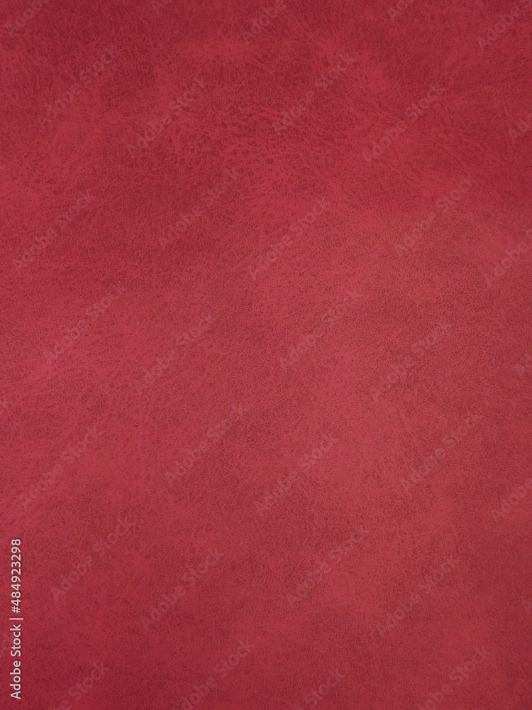 Burgundy suede surface textured as a background. High quality photo Burgundy suede surface textured as a background. High quality photo