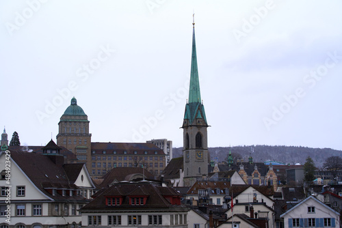 Main campus of University of Zürich UZH with Preacher's Church in the foreground on a snowy and rainy winter day. Photo taken February 1st, 2022, Zurich, Switzerland.
