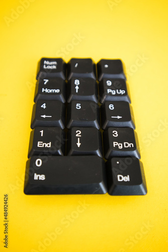 Numeric Keyboard keys placed in a paper in. photo