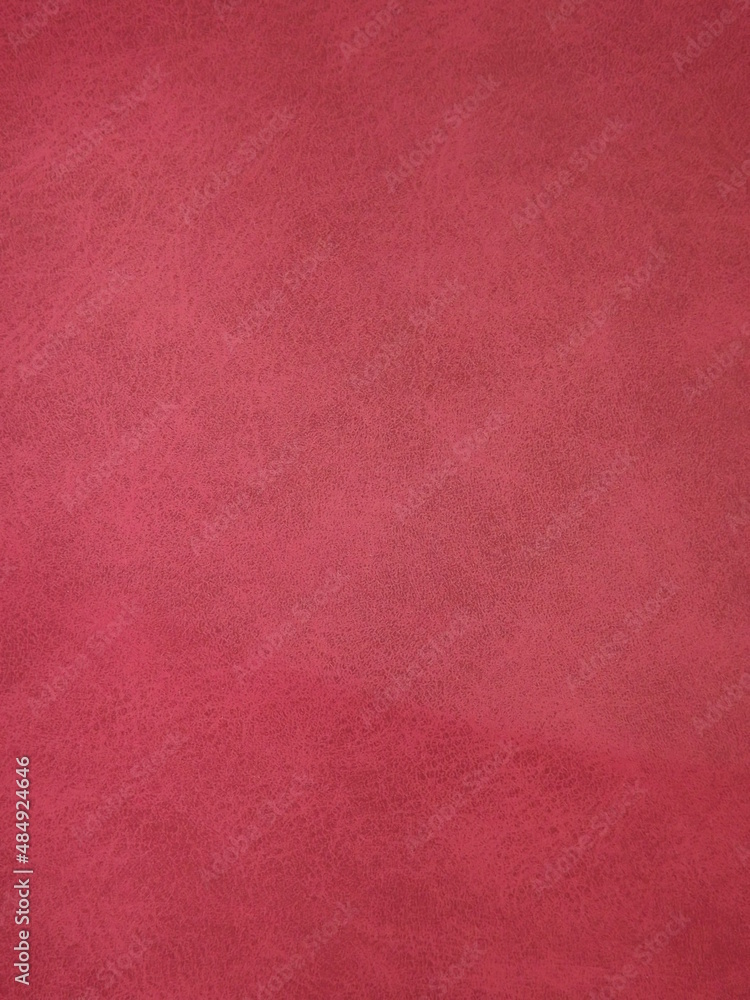 Fototapeta premium Burgundy suede surface textured as a background. High quality photo