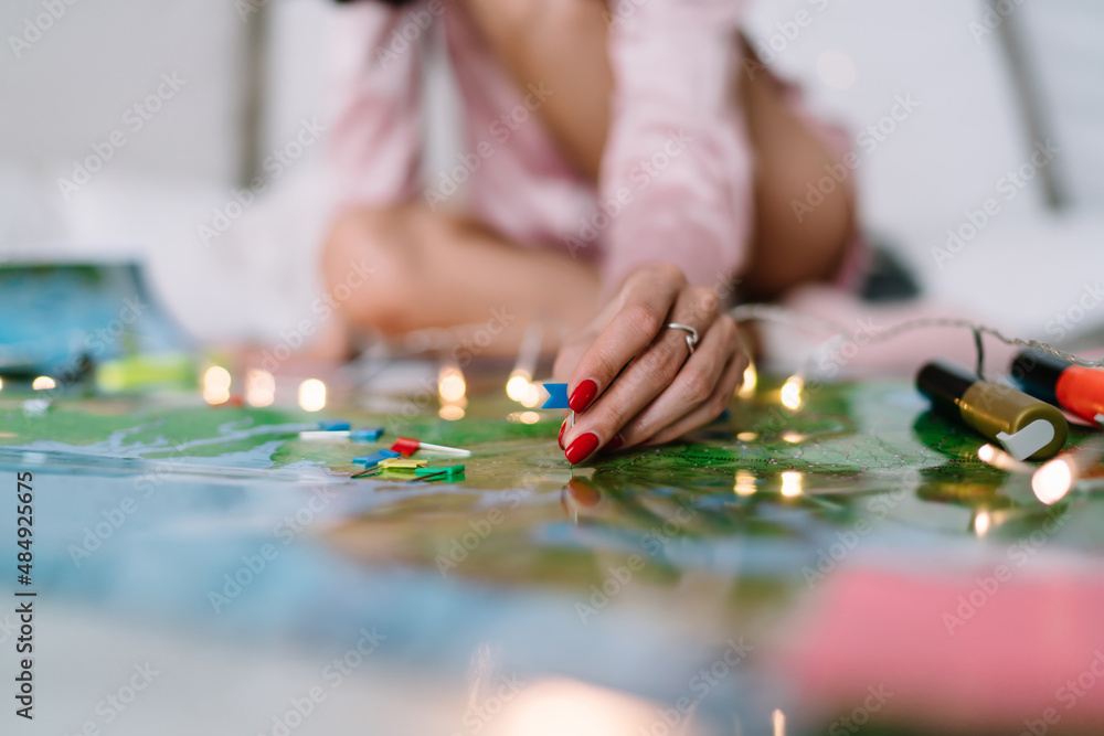 Girl pointing with notice board pins on Russia map Girl pointing with notice board pins on Russia map