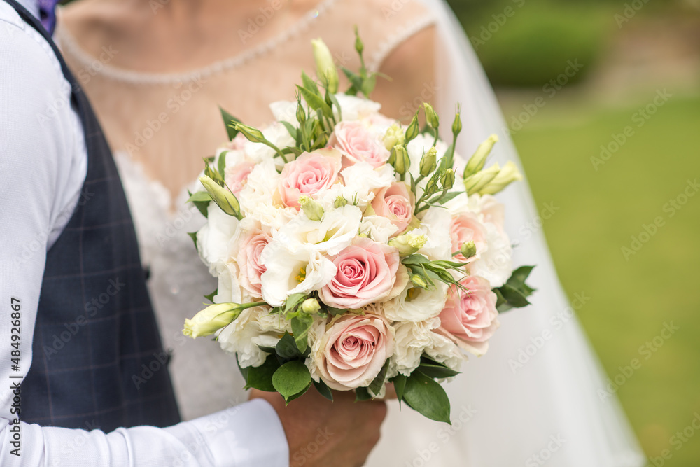 wedding bouquet in hands of bride wedding bouquet in hands of bride