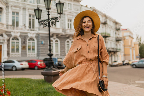 stylish young woman dressed in spring trendy dress