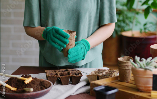 flowers. Gardening process. Spring. Seasonal. Eco friendly containers. Cultivate seedlings. Plant seeds. Gardening 