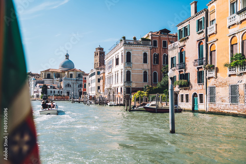 Fototapeta Naklejka Na Ścianę i Meble -  Scenery view of beautiful cityscape and italian architect buildings located in historic center of Venice, motorboat floating on grande canal around venetian streets during travel and tourism
