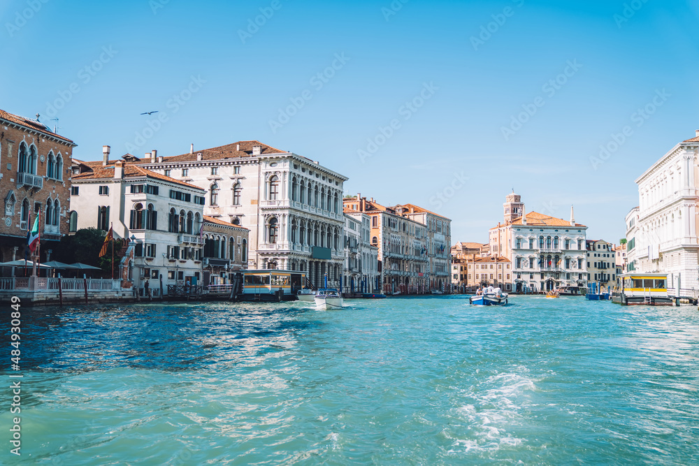 Concept of touristic journey trip for visiting romantic Italian city - Venezia during summertime for travelling around Europe, landscape view of beautiful historic buildings located at Grand Canal