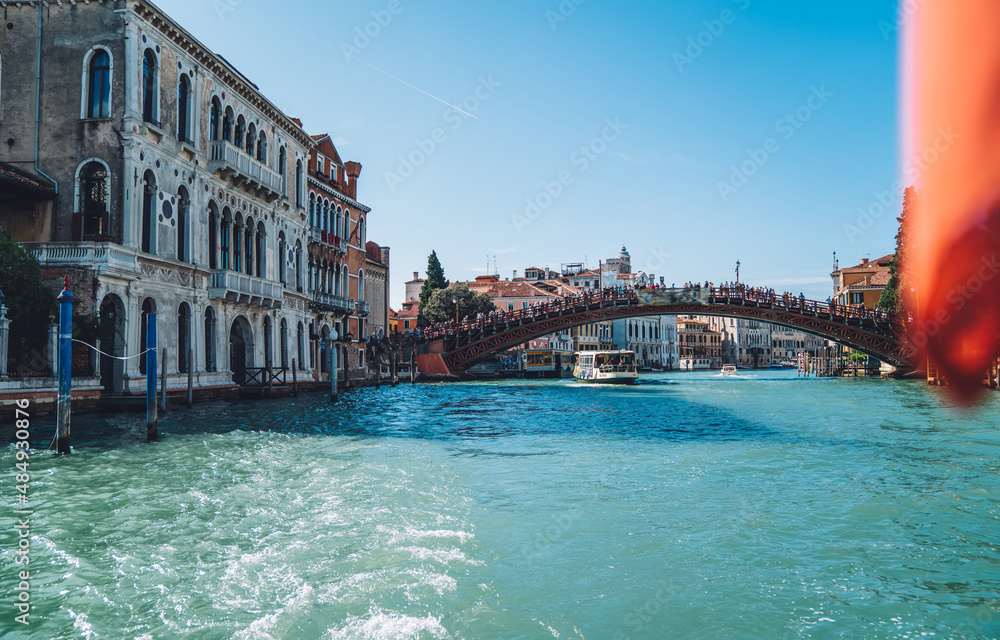 Scenery view on district with vintage buildings and urban setting with old historic architecture, famous bridge in Italian Venice - Ponte dell'Accademia must have for visiting on vacation