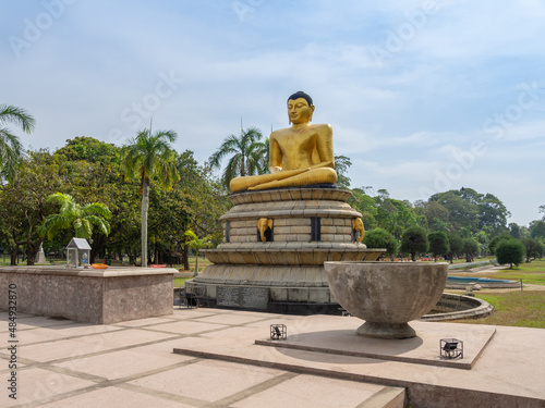 Buddha statue at the Viharamahadevi Park or Victoria Park, public park located in Colombo, Sri Lanka. photo
