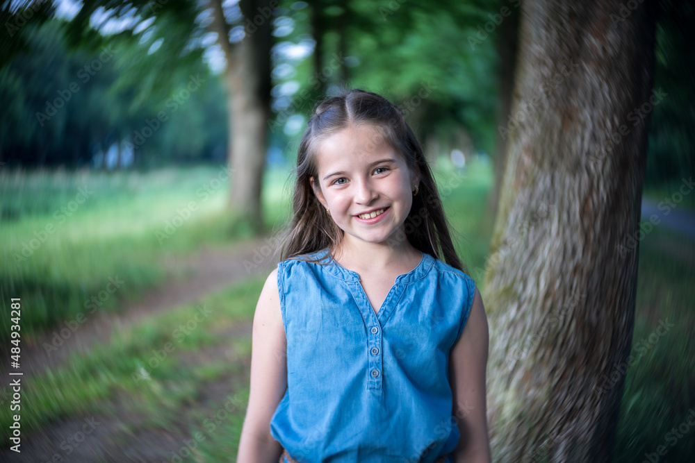 Portrait of a beautiful girl with long hair in nature. Portrait of a beautiful girl with long hair in nature.