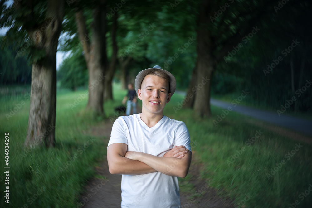 Portrait of a teenager on the background of nature. Natural skin of the face, without retouching. Portrait of a teenager on the background of nature. Natural skin of the face, without retouching.