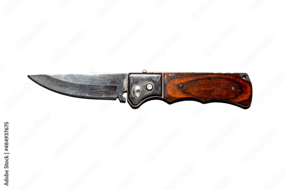 Folding switchblade knife with a button.Switchblade knife on a white background.Folding knife with wooden handle. Folding switchblade knife with a button.Switchblade knife on a white background.Folding knife with wooden handle.
