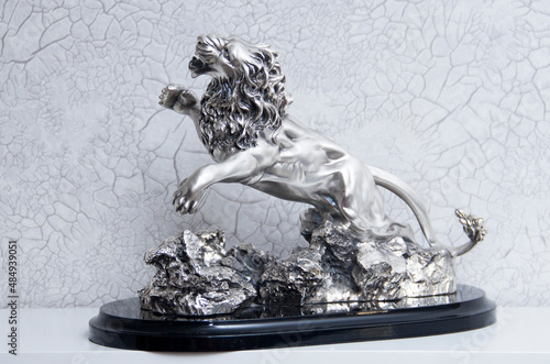 Silver lion statuette. A souvenir made of silver. A premium gift. photo