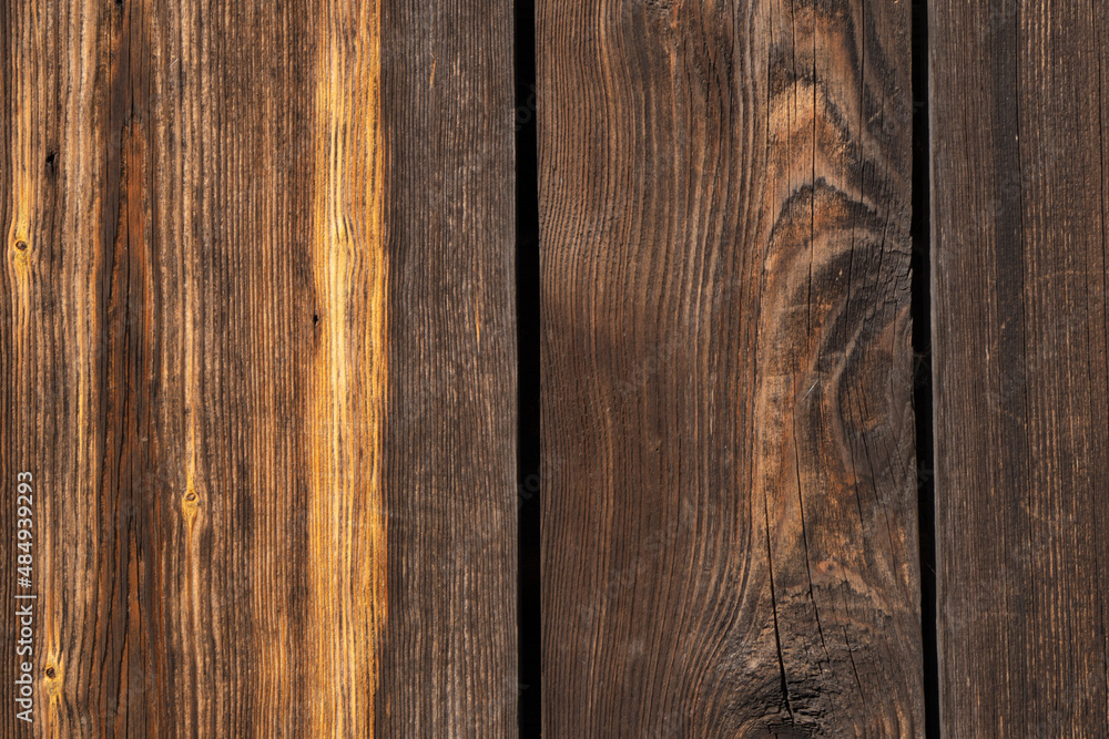 Rough wood boards of dark color. Wooden background