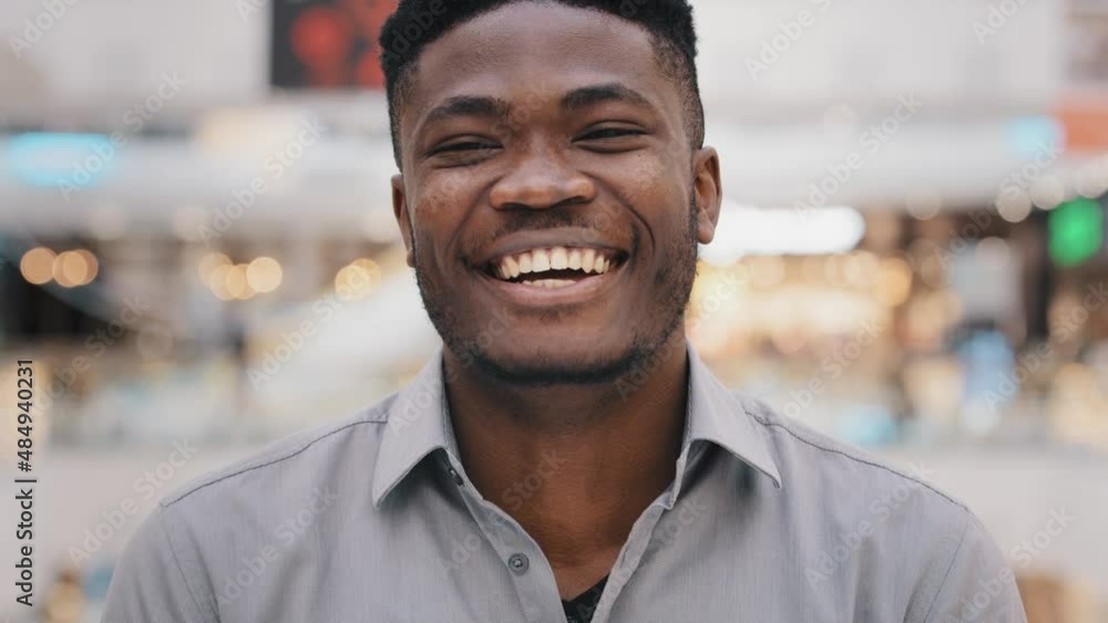 Close-up young african american guy looking at camera posing smiling toothy dental smile emotional positive man laughing at good news or funny joke demonstrating sincere cheerful emotions joy laughter Close-up young african american guy looking at camera posing smiling toothy dental smile emotional positive man laughing at good news or funny joke demonstrating sincere cheerful emotions joy laughter