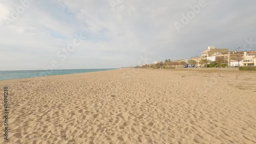 beautiful mediterranean beach sand footprints turquoise blue calm water photo