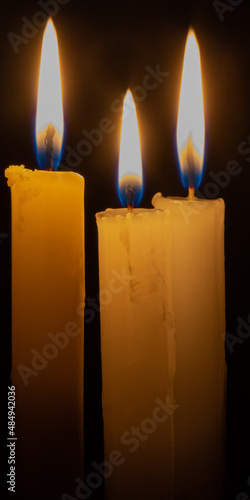 Candle flame at  closeup. Or Candle light in the dark