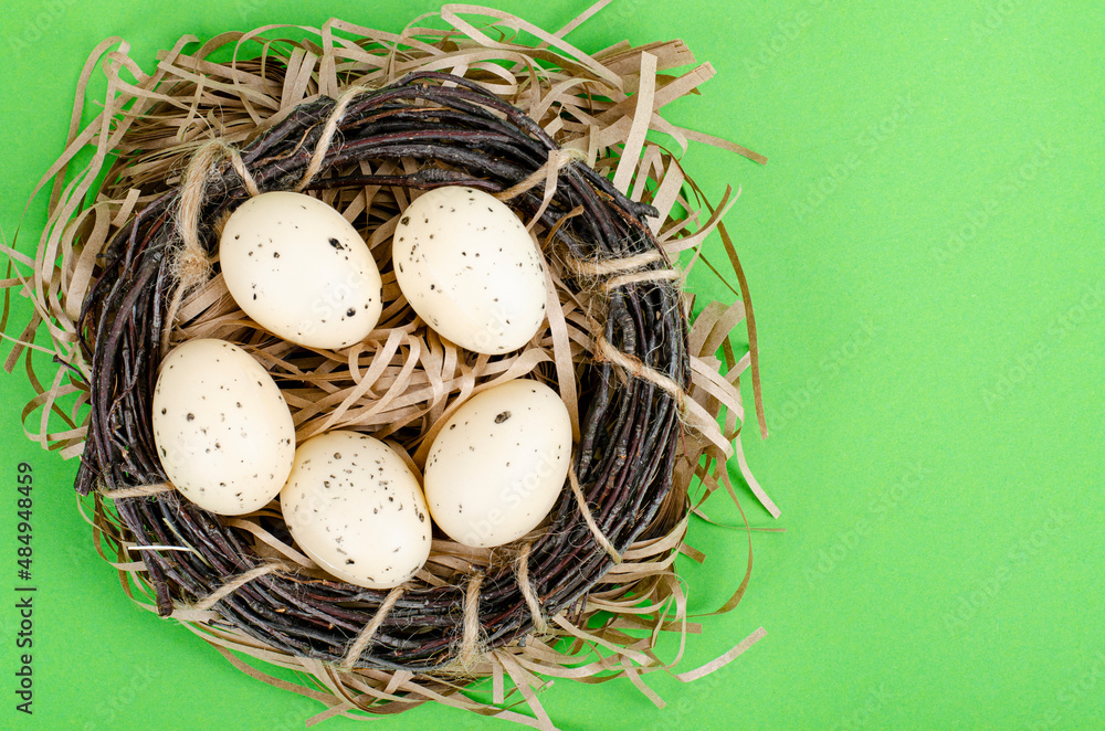 Top view of color easter haqndmade eggs and nest flatlay. Trendy minimal design spring background. Space for text. Stuio Photo Top view of color easter haqndmade eggs and nest flatlay. Trendy minimal design spring background. Space for text. Stuio Photo