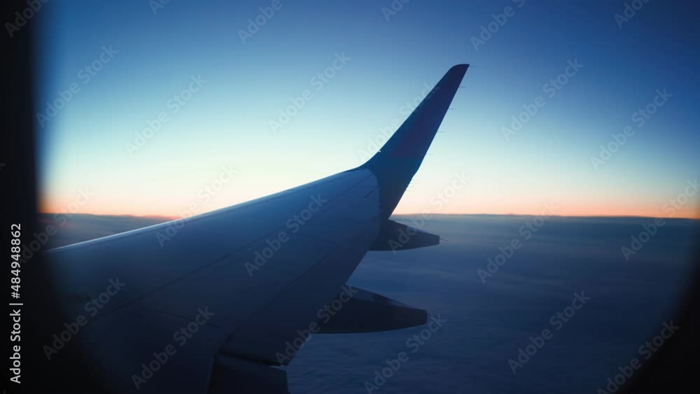 View from the window of a flying plane to the beautiful clouds. Air transport concept. View from the window of a flying plane to the beautiful clouds. Air transport concept.