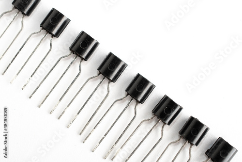 Row of electronic jfet on white background