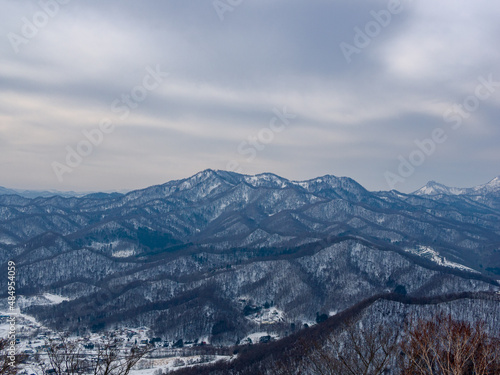 Snowy Mountainscape from the top of Mount Sapporo in Hokkaido, Japan 