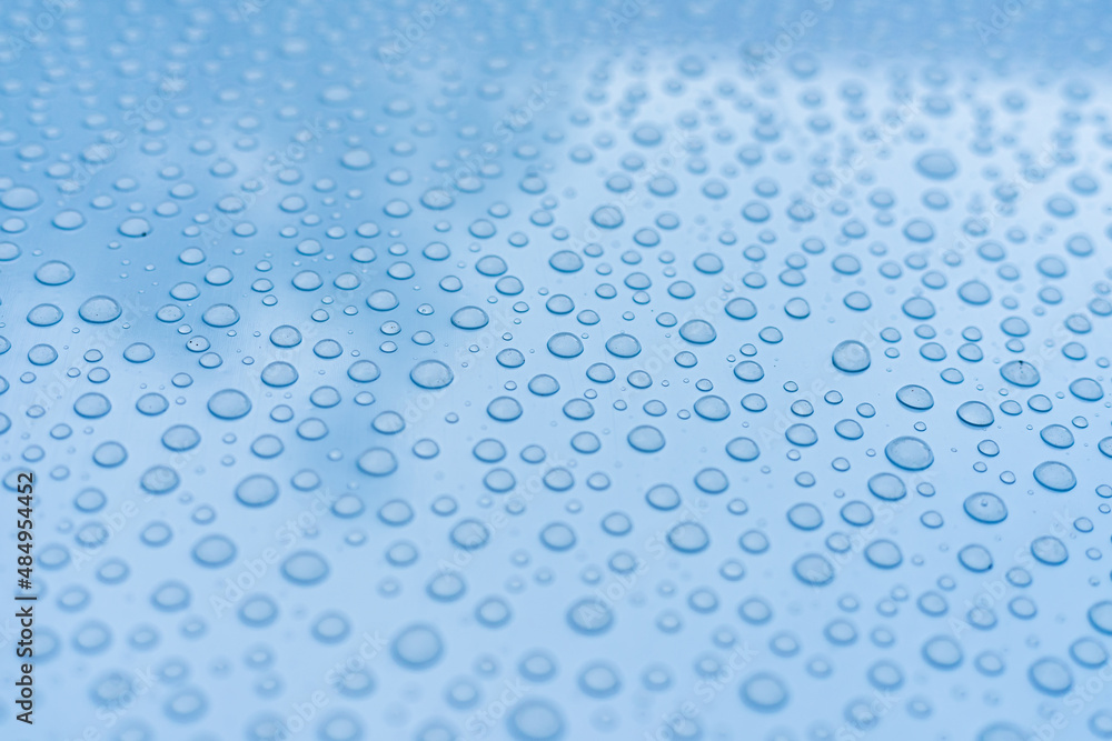 A bunch of droplets on a metal surface create a beautiful background or texture A bunch of droplets on a metal surface create a beautiful background or texture