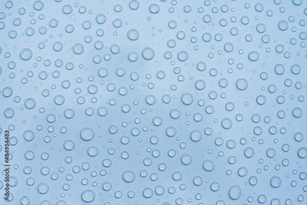 A bunch of droplets on a metal surface create a beautiful background or texture