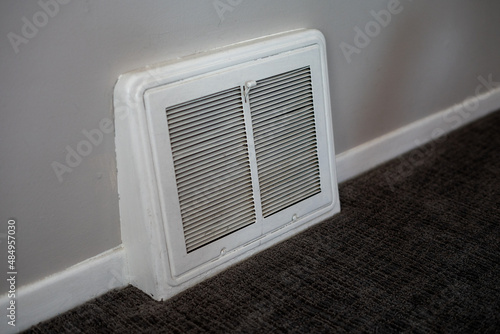 Wallpaper Mural Air vent inside a residential home with carpet and baseboards Torontodigital.ca