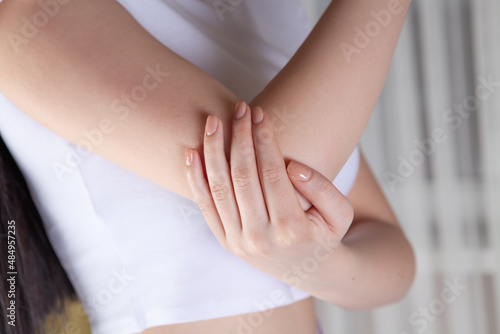 Wallpaper Mural Joint injuries,. Spasm on the girl's arm. Torontodigital.ca