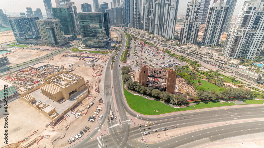 Bay Avenue with modern towers residential development in Business Bay aerial panoramic all day timelapse, Dubai