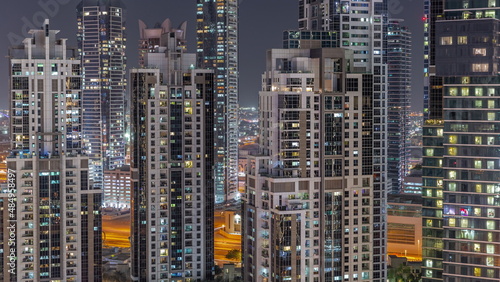 Bay Avenue with modern towers residential development in Business Bay aerial night timelapse, Dubai © neiezhmakov