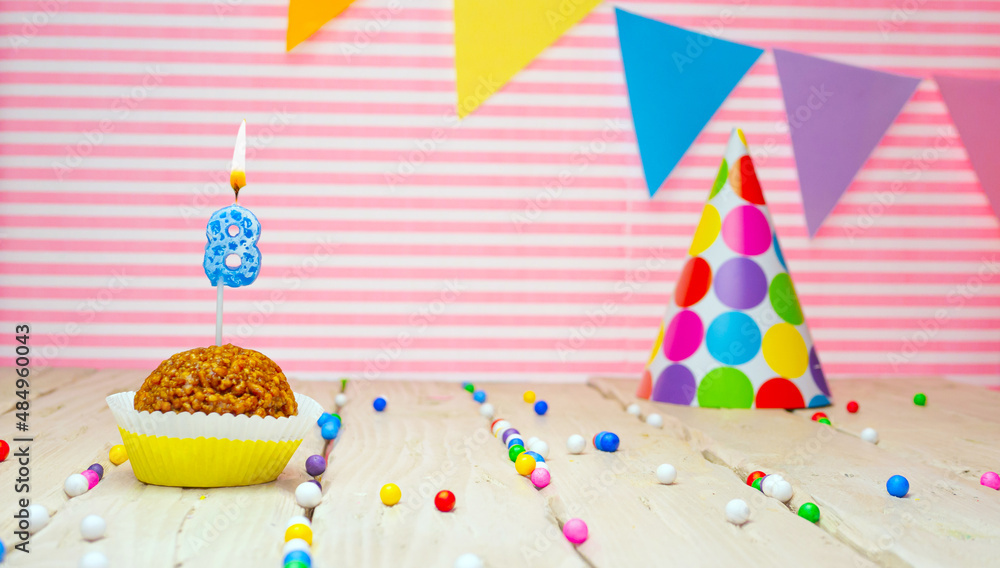 Happy birthday for 8 years old. Festive background with muffin. Copy